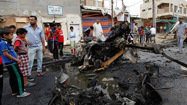 Photo of Car explosion targeting 12 Shia volunteers in northern Baghdad