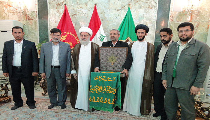 Photo of Imam Redha Holy Shrine’s banner presented to Iraqi Popular Mobilization Forces