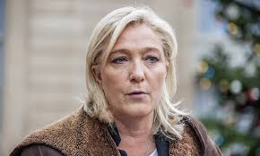 Photo of Marine Le Pen goes on trial charged with anti-Muslim hate speech
