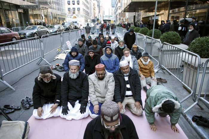 Photo of Muslims hold prayer meeting outside Trump Tower in protest