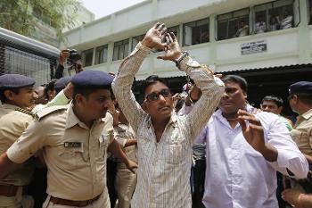 Photo of Indian court hands down 11 life sentences for 2002 anti-Muslim rioting