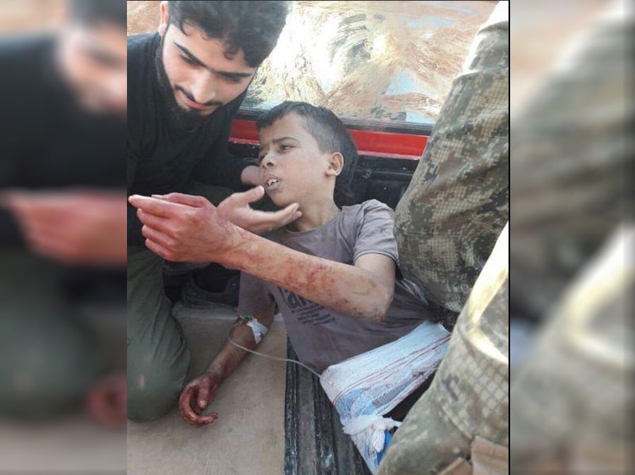 Photo of Fighters from a US-backed Syrian militant group have been filmed brutally beheading a child
