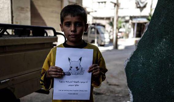 Photo of Syrian children hold Pokémon photos praying ‘world will find them