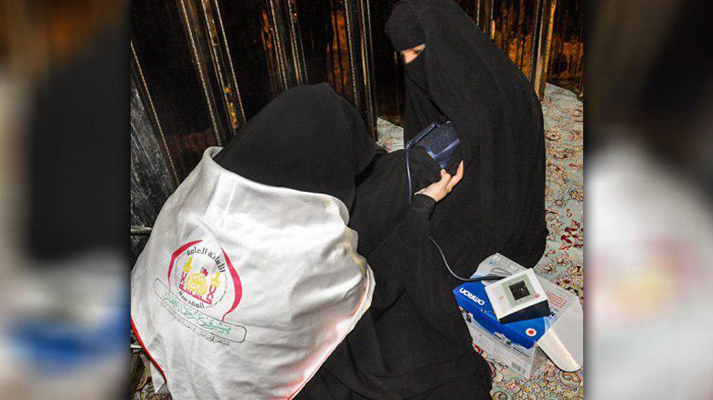 Photo of Volunteer female medical practitioners offer medical assistance to pilgrims