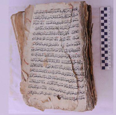 Photo of Imam Hussain center to restore a 300-year-old holy Quran