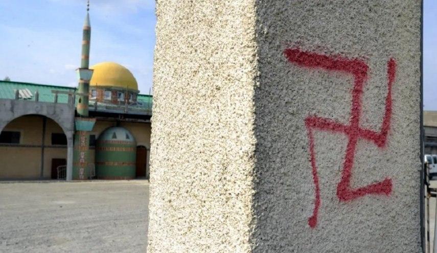 Photo of Agen mosque targeted by several tags, including  swastika