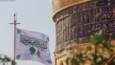 Photo of Banner of Al-Ghadir raised over shrine of Commander of the Faithful, peace be upon him
