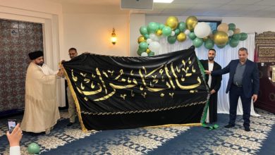 Photo of Director of IHTV Group in Europe hands banner of Commander of the Faithful to Al-Haidari Center in London