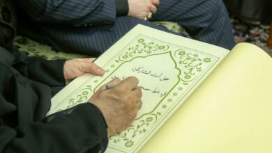 Photo of Arbaeen pilgrims from 16 countries handwrite the Holy Quran