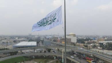 Photo of Banner of Imam Ali hoisted in center of Najaf to mark his honorable birth anniversary