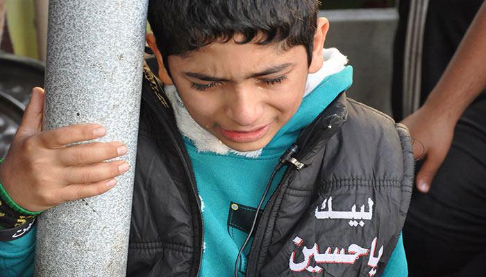تصویر شفای یک کودک معلول عراقی، در ایام اربعین حسینی