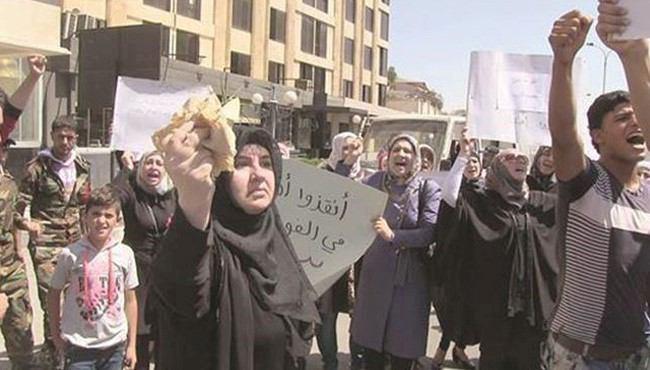 تصویر تظاهرات اهالی فوعه و کفریا برای لغو محاصره اين دو شهر شيعه نشين