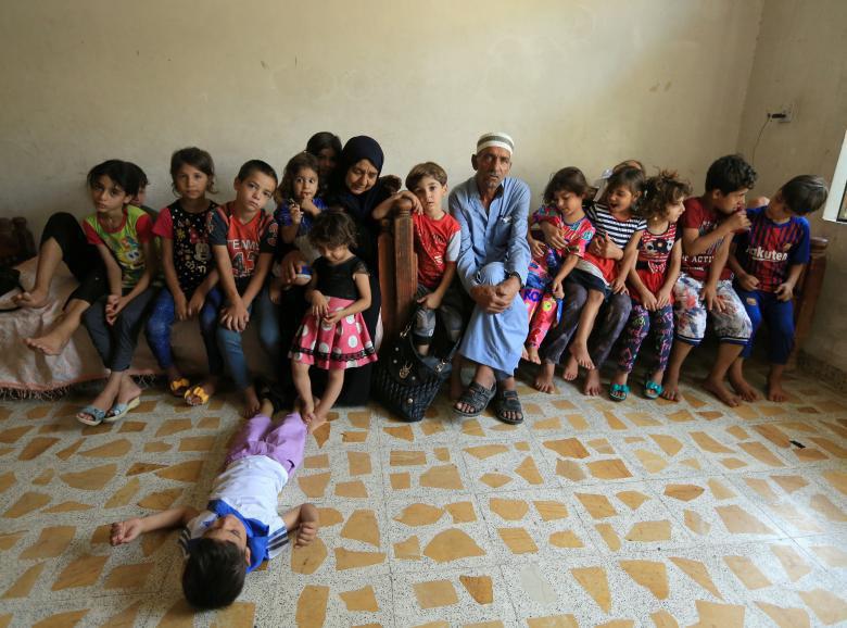 تصویر مادر عراقی که داعش فرزندانش را کشت اما مادر ۲۲ کودک شد